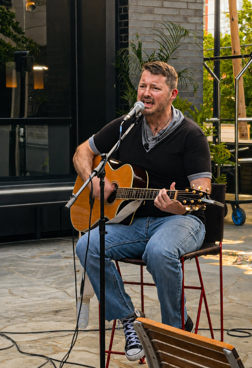 Boomer Roe with guitar